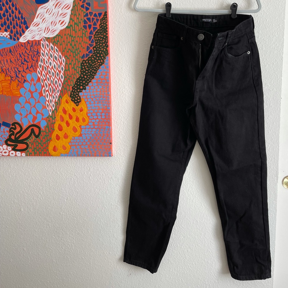 Black, mom jeans, never been worn. Silver button detail on zipper